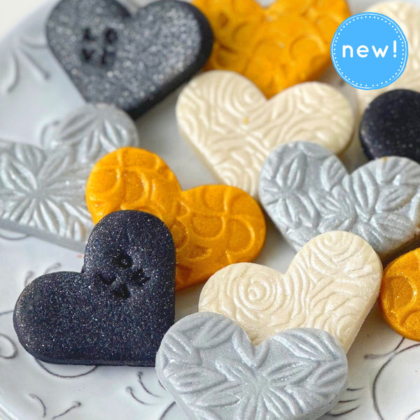 valentine's day elegant gold silver marzipan hearts closeup