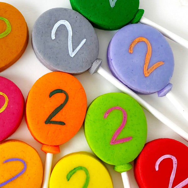 birthday balloon marzipan candy lollipops close up plain