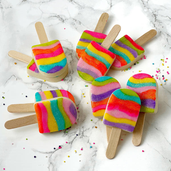 fantasy rainbow glitter candy marzipan popsicles in piles