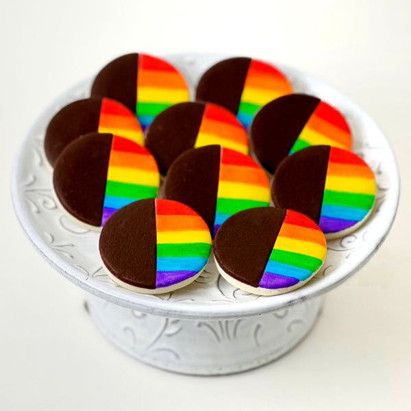 pride rainbow black & white cookies on a plate