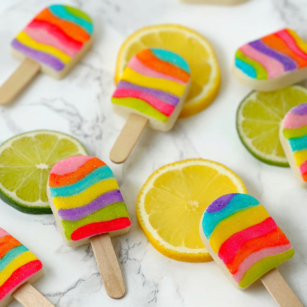 fantasy rainbow glitter candy marzipan popsicles on fruit