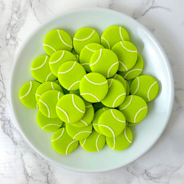 mini marzipan tennis candy bites on a plate