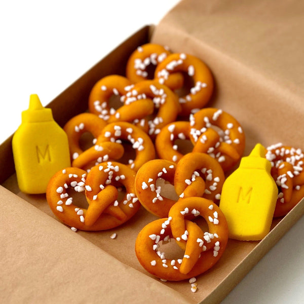 marzipan pretzels and mustard in a box