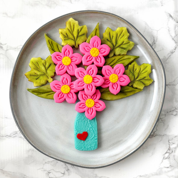 marzipan spring flower bouquet on a grey plate