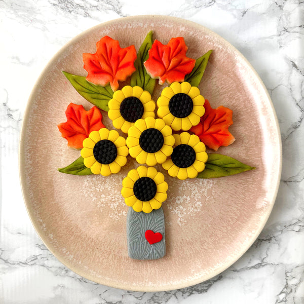 autumn flower bouquet on a pink plate