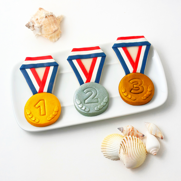 olympics party medals gold silver bronze on a plate