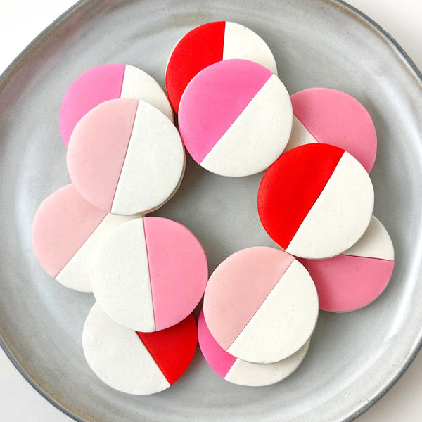 valentine's day black & pink & red & white cookies on  a plate