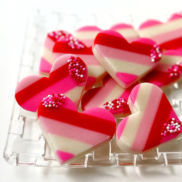 striped valentine's day hearts closeup on a glass plate