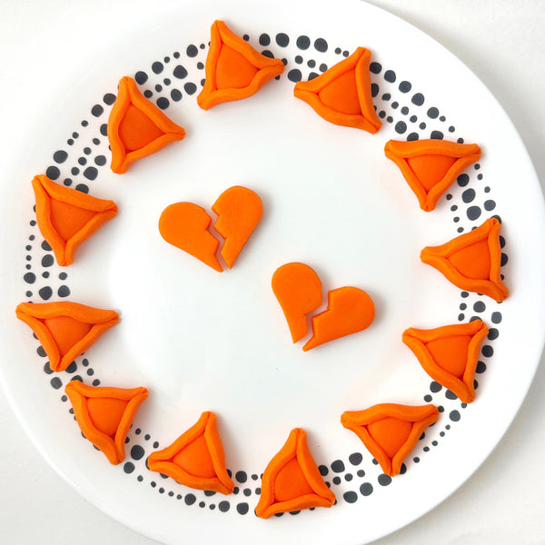 orange hamantaschen in memory of the Bibas family