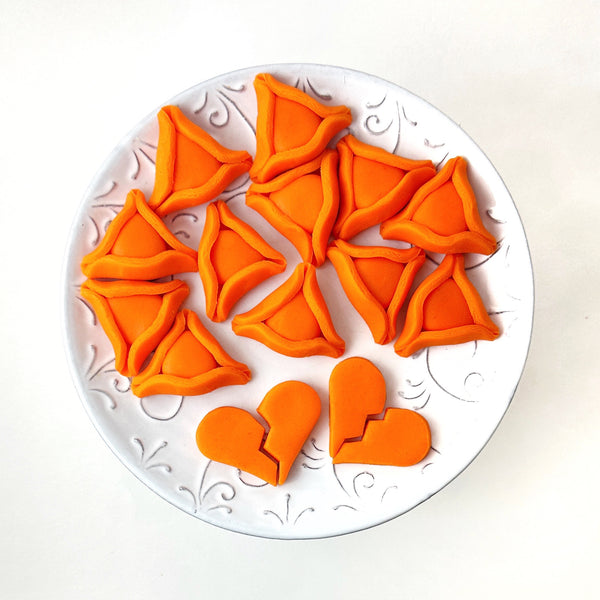 orange hamantaschen in memory of the Bibas family