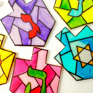 stained glass Hanukkah dreidels closeup