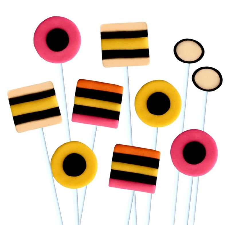 assorted allsorts in pink, yellow and black marzipan candy lollipops