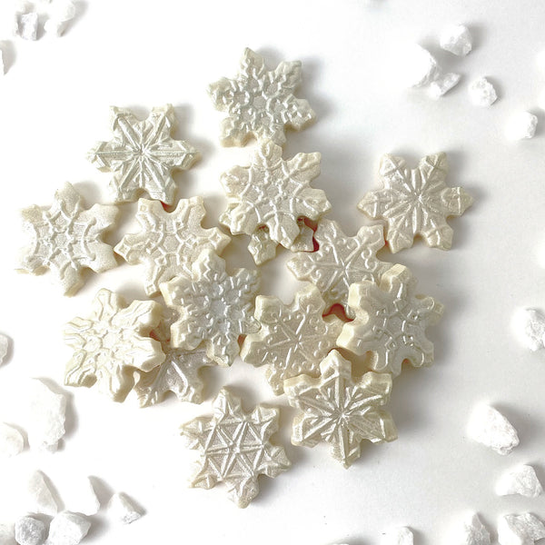Christmas winter snowflake marzipan candy tiles in a pile