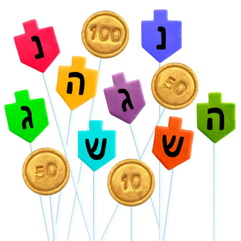 Hanukkah dreidels and gold gelt coins marzipan candy lollipops