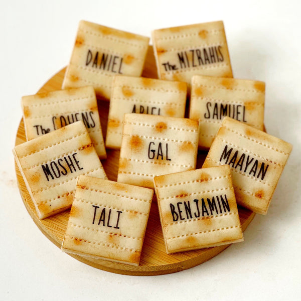 personalized marzipan matzah place settings on a tile