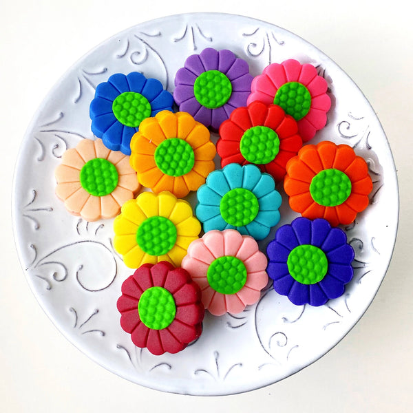 rainbow flower marzipan candy tiles on a plate
