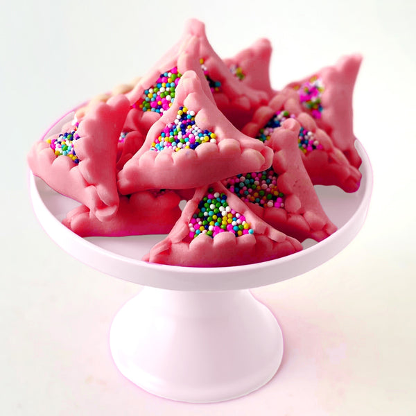 purim marzipan pink hamantaschen on a cakeplate