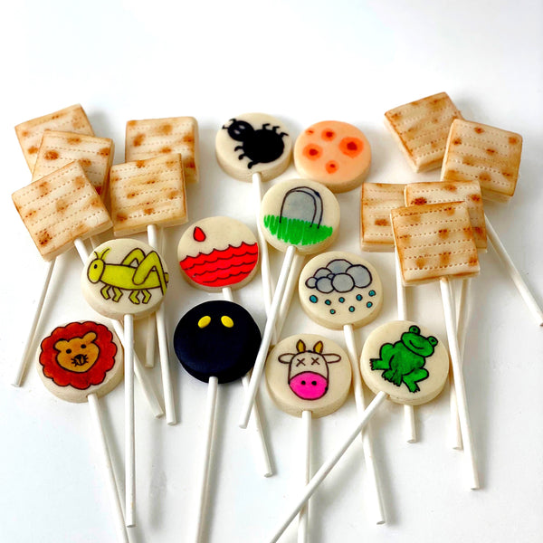 Passover Seder candy matzah ten plagues with frogs marzipan lollipops flatlay