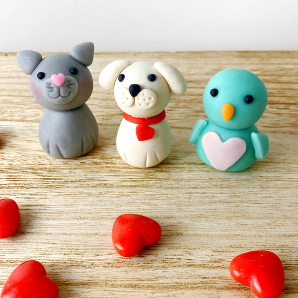 Valentine's Day animals cat dog bird heart marzipan candy sculpture treats on wood