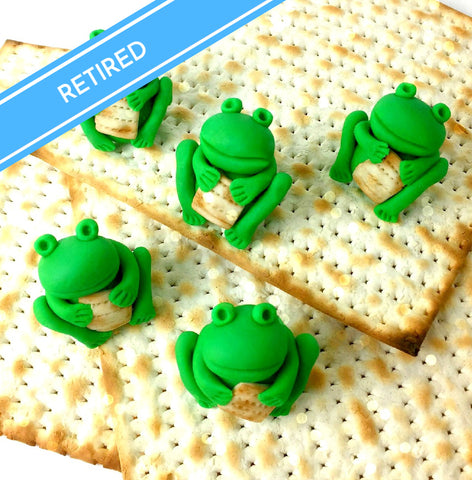 frogs holding matzah