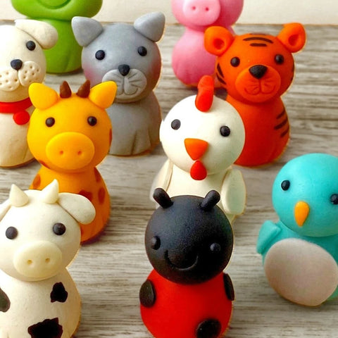 cute animal menagerie assorted marzipan candy sculptures closeup