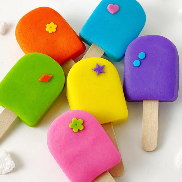 colorful marzipan candy popsicles closeup