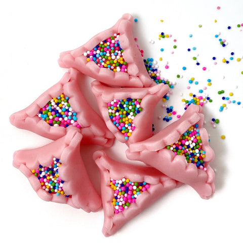 purim marzipan pink hamantaschen in a pile