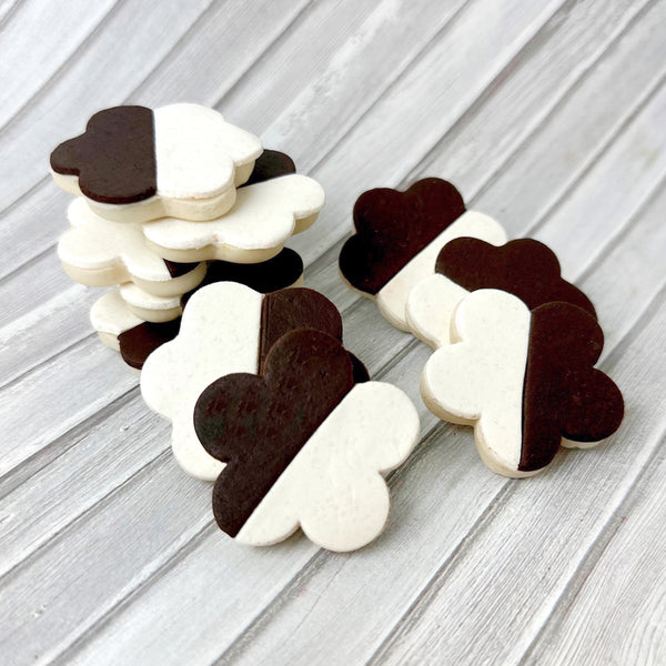 black and white flower cookies  in a pile