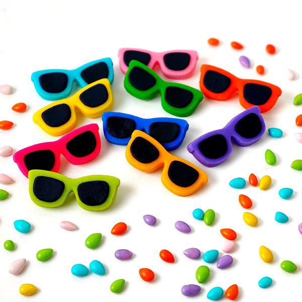 sunglasses rainbow beach party candy flatlay