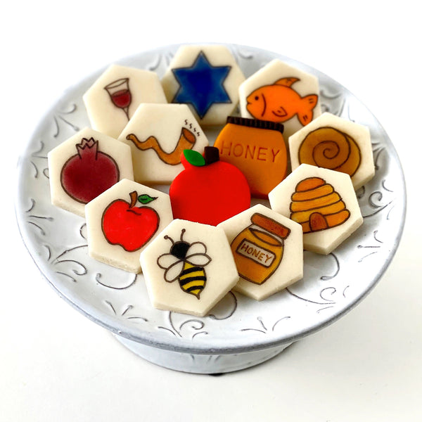rosh hashanah hand-drawn marzipan candy tile treats on a plate