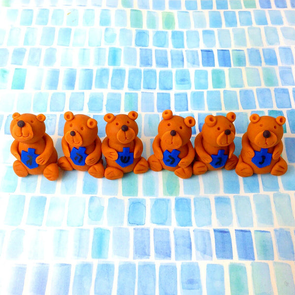 Hannukah teddy bears holding dreidels in a row marzipan animal sculpture treats