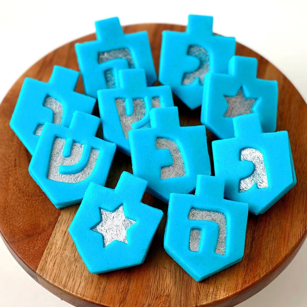 Hanukkah blue dreidel linzer marzipan gift on a plate