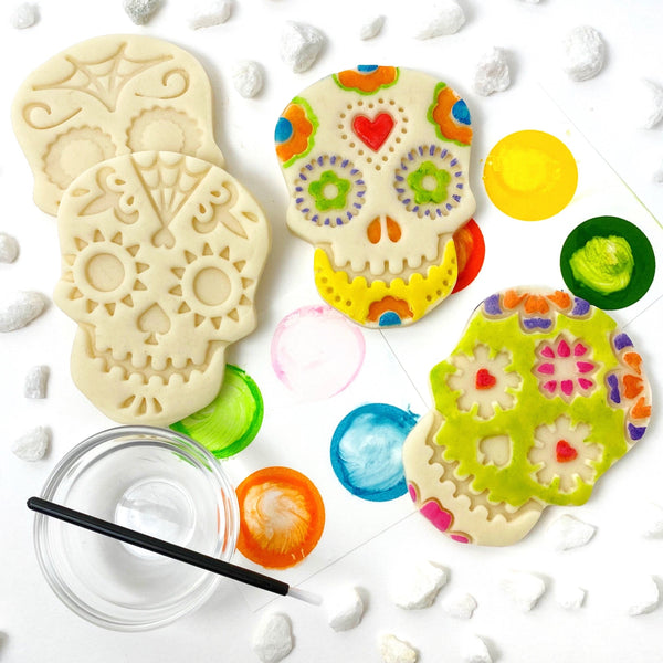 paint your own sugar skull marzipan candy treats laid out