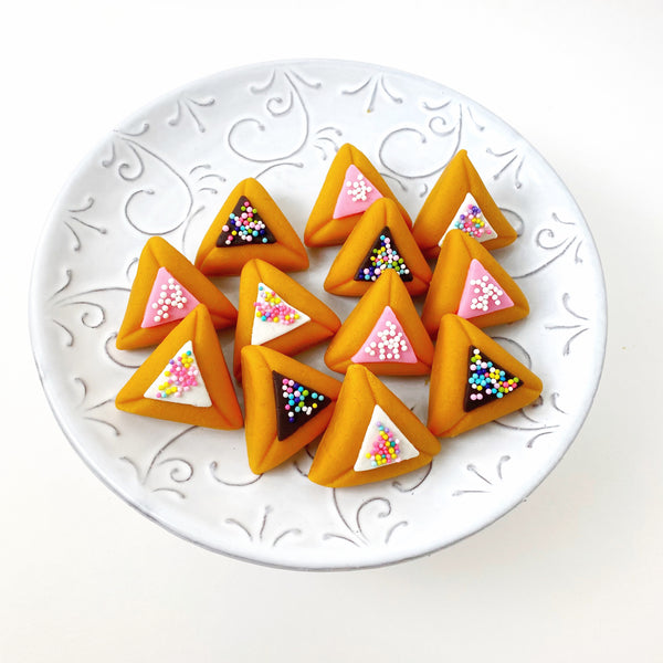 purim hamantaschen donuts on a plate