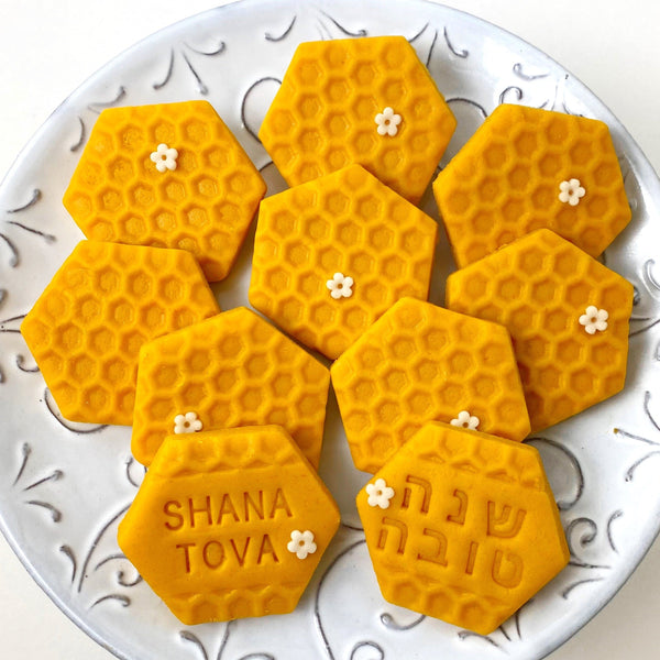 hebrew english rosh hashanah shana tova greetings marzipan candy tile on a plate