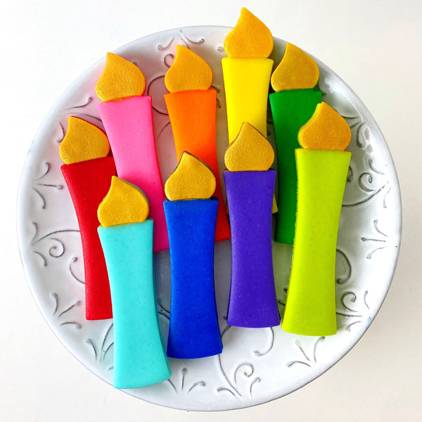 hanukkah rainbow menorah candles marzipan candy on a plate