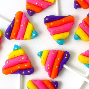 rainbow unicorn poop with gold stars marzipan candy lollipops closeup
