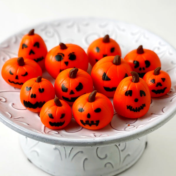 halloween jack o lantern candy sculptures on a plate