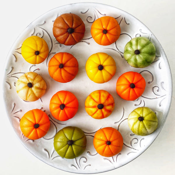 thanksgiving marzipan pumpkins and gourds on a plate
