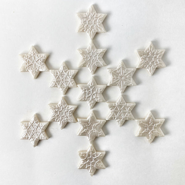 Hanukkah star of David snowflake candy tiles formation
