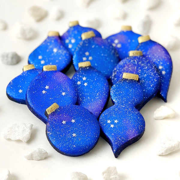 marzipan galaxy christmas ornaments in  a pile