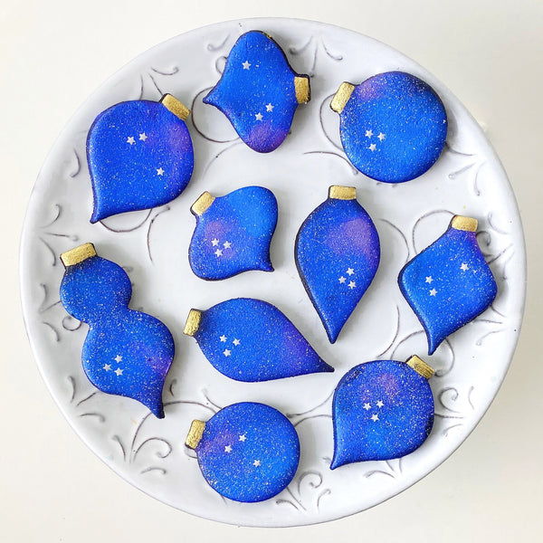 marzipan galaxy christmas ornaments on a plate