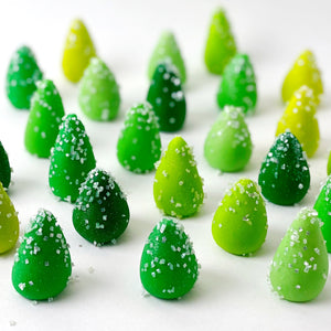 mini green Christmas tree marzipan candy sculpture treats forest closeup
