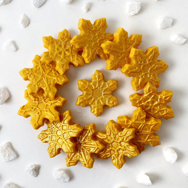 gold snowflake marzipan candy tiles in a circle