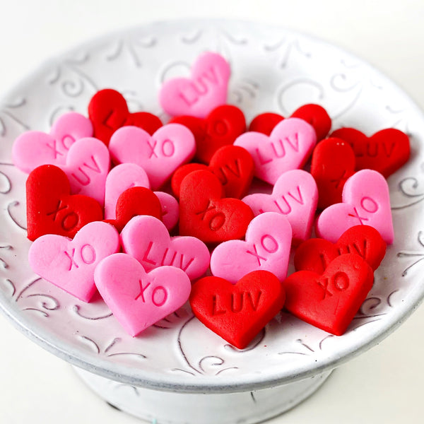 Valentine's Day pink & red hearts mini marzipan candy bites on a plate
