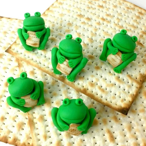 Passover Seder frogs holding matzah candy sculpture treats from the ten plagues