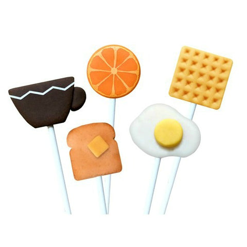 breakfast foods with waffle, orange, sunnyside egg, toast and coffee cup marzipan candy lollipops