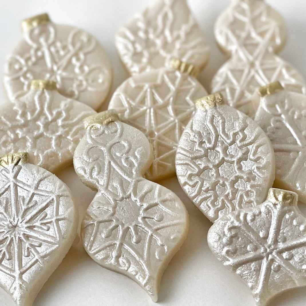 snowflake christmas marzipan ornaments closeup